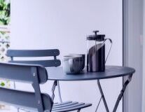 kitchen appliance, home appliance, wall, indoor, furniture, design, tableware, computer, desk, small appliance, kettle, sink, coffeemaker, coffee cup, mug